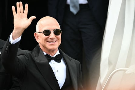 Jeff Bezos waves in a tux.