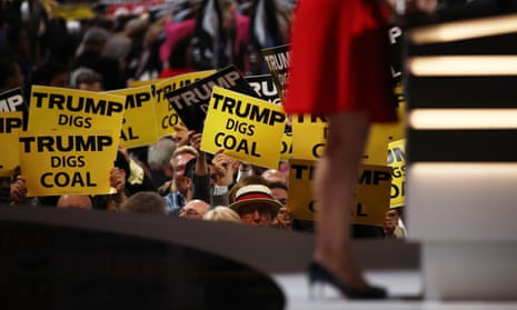 Delegates hold signs that read 'Trump Digs Coal' on the second day of the Republican National Convention