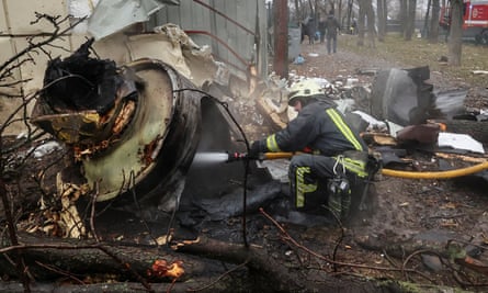 A firefighter extinguishes the remains of an unidentified missile