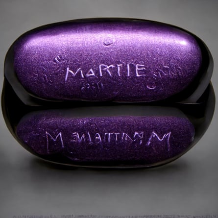 purple pill with ‘Martie’ appearing to be etched on it