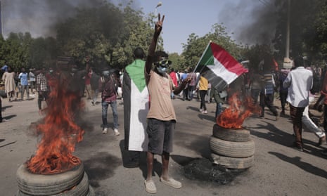Demonstrators in Khartoum take part in a protest on Sunday against the October military coup and the subsequent deal that reinstated Abdalla Hamdok