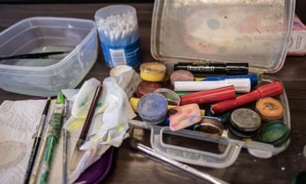Face paints on a table backstage during a performance.