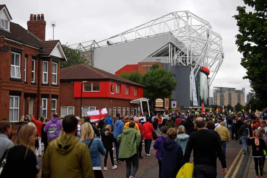 Supporters head towards Old Trafford.
