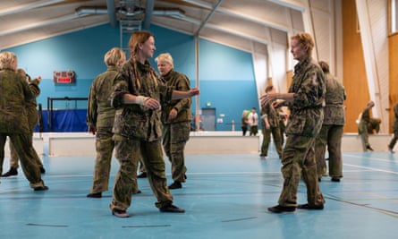 A group of Finnish women tackle unarmed combat as part of their training course.