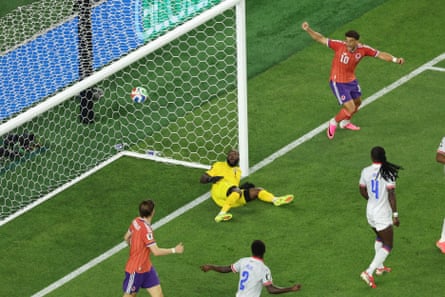 Haiti goalkeeper Johny Placide fails to save John McGinn’s goal
