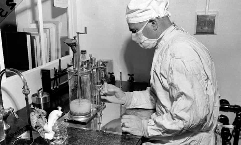 A scientist fills a vial with the BCG vaccine against tuberculosis in Albany, New York in 1947