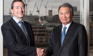 The handshake between John Ridding and Tsuneo Kita on 1 December 2015.
