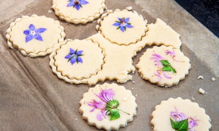 Shortbread biscuits with edible flowers pressed into the top.