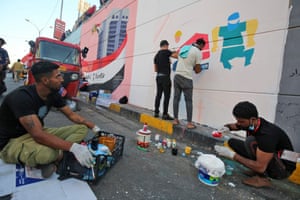 Painting a mural in Tahrir Square, Baghdad, on November 8, 2019 as the capital braced for another day of anti-government demonstrations. Taking spray paint to grimy concrete walls, Iraqi artists - many of them young women - have been sketching out their vision for a brighter future on the walls and the faces of those who have been killed. Their murals have transformed a monochrome tunnel leading into the main protest camp in Tahrir (Liberation) Square into a revolutionary art gallery. 
