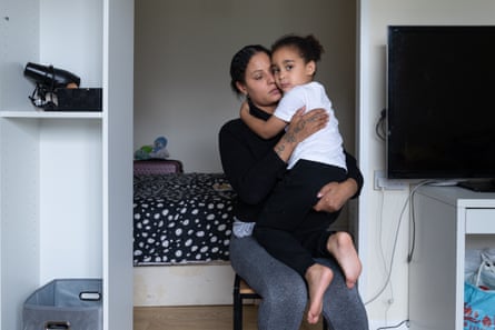 Charlene sat on a chair holding her son