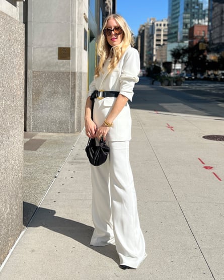 woman wearing an all white outfit outside on sidewalk