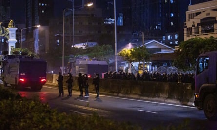 Riot police gather at an anti-government rally at Din Daeng Intersection in Bangkok, Thailand.