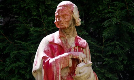 A statue depicting 18th-century French philosopher Voltaire  is daubed in red paint in Paris