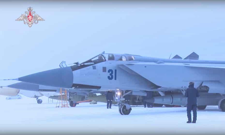 A still from a video made available by the Russian Defence ministry shows Russian servicemen examine a Kinzhal hypersonic missiles before a flight of the MiG-31K fighter jet on 19 February 2022