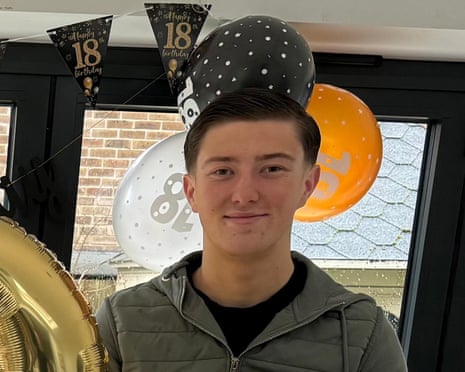 Henry Nowak handout pic with birthday balloons and banners behind him