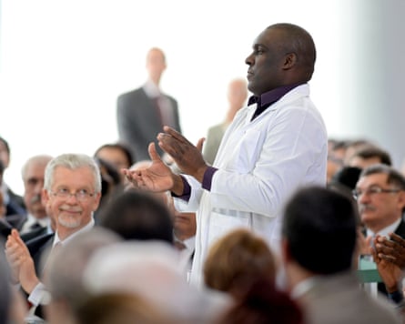 Cuban doctor Juan Delgado is honoured during a ceremony to sanction the law establishing the More Doctors programme in Brasilia, October 2013.