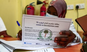 A medical worker prepares vaccination card for a person receiving a dose of the Oxford-AstraZeneca vaccine in Sudan’s capital Khartoum. Sudan was the first in the Middle East and North Africa to receive vaccines through Covax, a UN-led initiative that provides jabs to poor countries