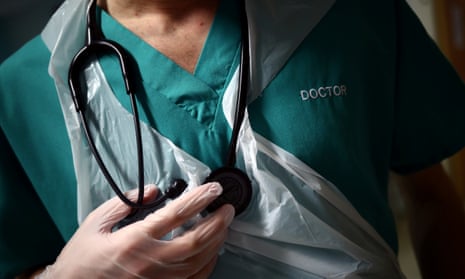 A junior doctor holding his stethoscope.