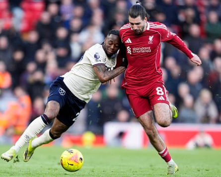 Liverpool’s Dominik Szoboszlai (right) and Aaron Wan-Bissaka of West Ham battle for possession at Anfield