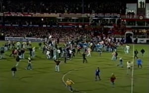 Joyous Sunderland fans flood on to the Roker Park pitch following their team's 2-1 win over Chelsea in their 1992 FA Cup quarter-final replay.