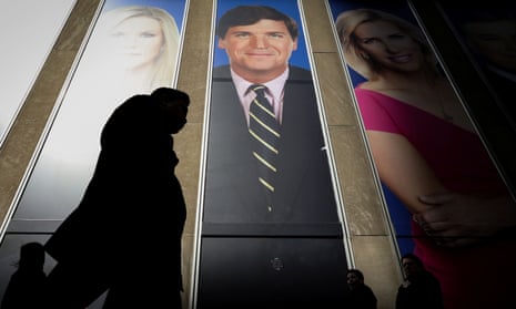 A promotional poster of Tucker Carlson, one of Trump’s most vocal proponents, on the News Corporation building in New York.