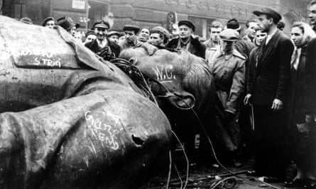 People gather around a fallen statue of Soviet leader Josef Stalin in Budapest, in 1956.