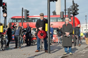 Callum Barnard, 27, lays a wreath on Remembrance Sunday for the first time despite lockdown restrictions in England. People had been asked to stay away from the cenotaph for the first time in history because of the continuing Covid-19 pandemic
