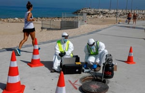 Technicians from Israeli firm Kando extract sewage samples from a manhole in the southern coastal Israeli city of Ashkelon.