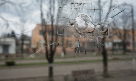 view of marinka seen through a window with a bullet hole in it