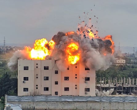A fireball errupts from the site of an Israeli airstrike on a building
