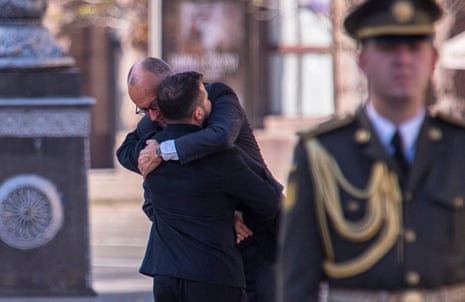Merz embraces Zelenskyy before a commemorative ceremony at the memorial of fallen Ukrainian soldiers at Independence Square in Kyiv, Ukraine, Sunday, Oct. 4, 2026. (AP Photo/Dan Bashakov)