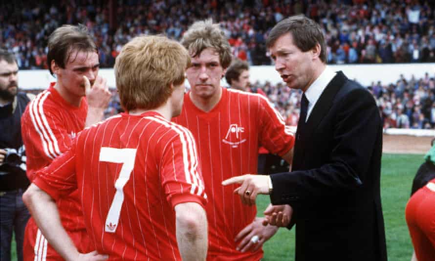 Aberdeen manager Alex Ferguson discusses team tactics before extra time at the 1983 Scottish Cup Final.
