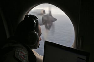In this March 2014 photo, flight officer Rayan Gharazeddine on board a Royal Australian Air Force AP-3C Orion searches for the missing Malaysia Airlines Flight MH370 in southern Indian Ocean.