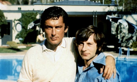 Evans, left, with director Roman Polanski in his book The Kid Stays in the Picture.