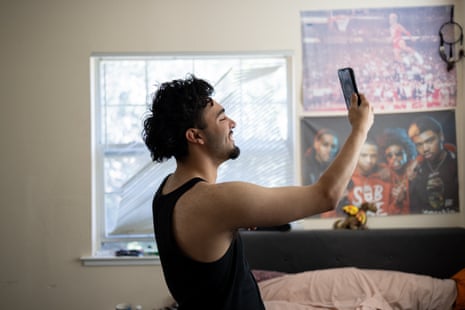 A man facetiming in his bedroom