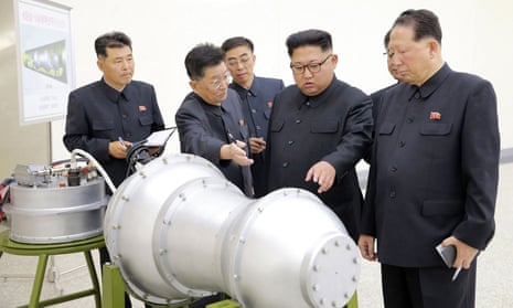 This picture was released by North Korea’s official Korean Central News Agency (KCNA) on Sunday, purportedly showing leader Kim Jong-Un (centre) looking at a hydrogen bomb