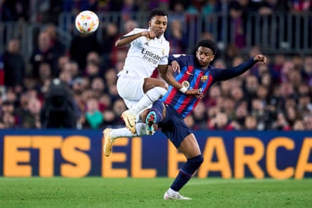 Rodrygo, left, competes for the ball with Barcelona’s Alejandro Balde.