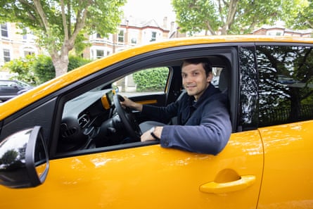 Jasper Jolly at the wheel of a yellow Renault Twingo