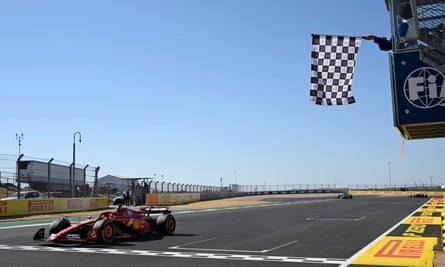 Charles Leclerc takes the chequered flag.