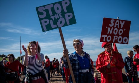 People gather in Whitstable, England, in October 2022, to protest against sewage discharges by Southern Water.