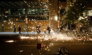 People run as police disperse protesters in Washington DC.