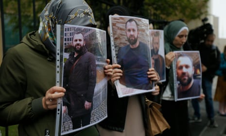 People hold portraits of Zelimkhan Khangoshvili in front of the German embassy in Tbilisi in September