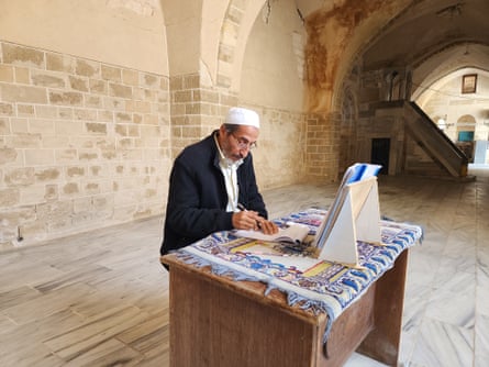 Tarek Haniya sits at a table