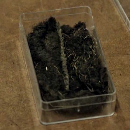 A braid in a small glass case