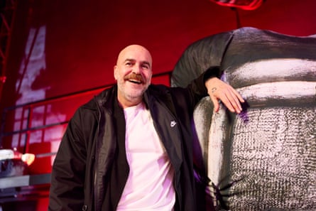 Andreas Angelidakis smiling in a contemporary art installation.
