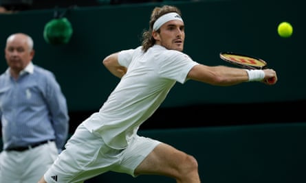 Andy Murray of Britain plays Stefanos Tsitsipas eyes a backhand return to Andy Murray during their second round match on day four of the 2023 Wimbledon Tennis Championships.