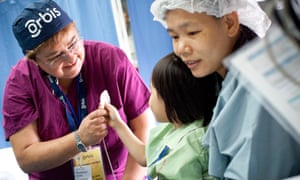 A volunteer ophthalmic nurse in the recovery room.