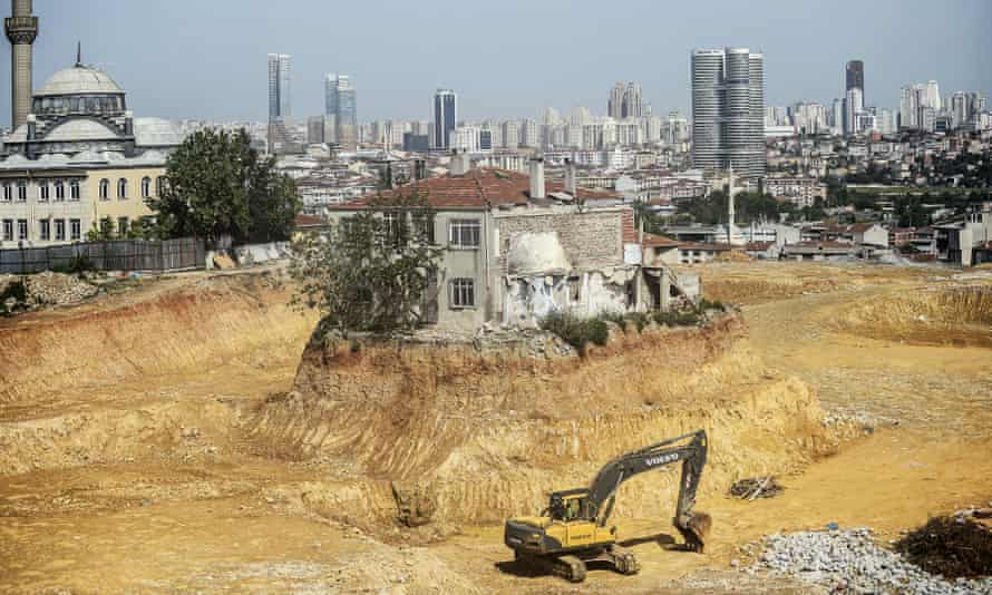 A lone house stands at a construction site in the Fikirtepe district of Istanbul in 2014, as the owner refuses to give his approval for its demolition.