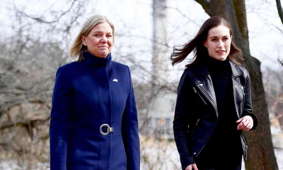 The Swedish prime minister, Magdalena Andersson, (left) receives the Finnish prime minister, Sanna Marin, before a meeting in Stockholm.