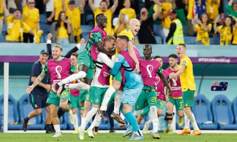 Australia celebrate at the final whistle after beating Denmark to reach the last 16 of the World Cup